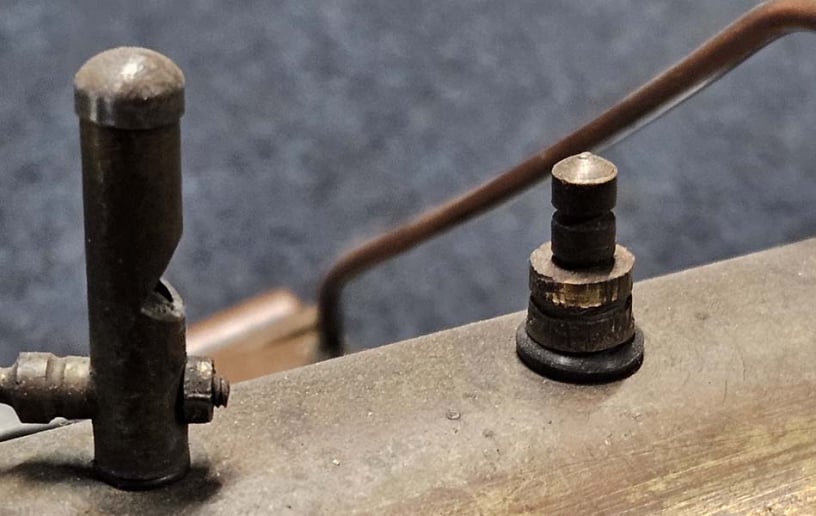 Model steam engine whistle and safety valve